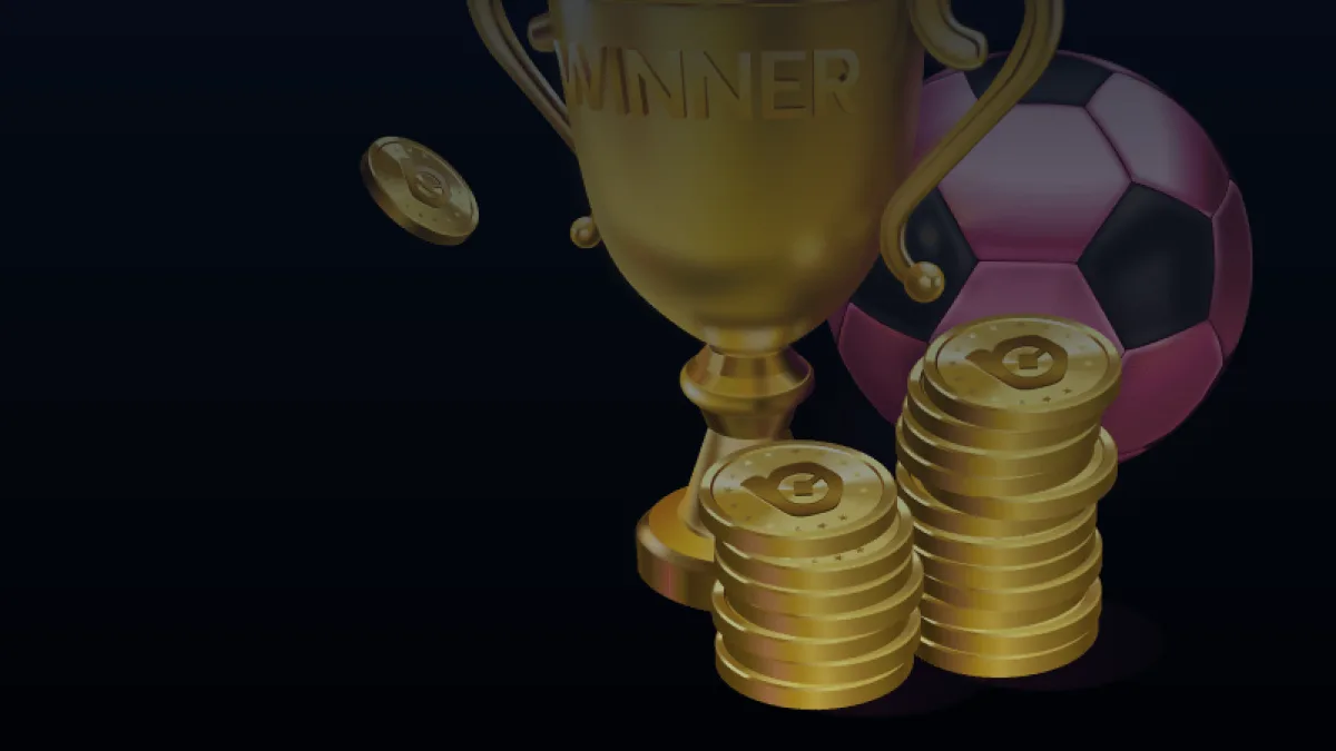 Cúp vàng WINNER, hai chồng đồng xu và quả bóng trên nền tối